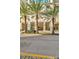 Grand building entrance with palm trees enhances the curb appeal at 450 Knights Run Ave # 1005, Tampa, FL 33602