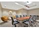 A well-appointed conference room with a large table and comfortable seating, perfect for business meetings at 450 Knights Run Ave # 1005, Tampa, FL 33602