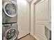 Modern laundry room featuring stacked washer and dryer units for space-saving convenience at 450 Knights Run Ave # 1005, Tampa, FL 33602