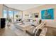 Living room featuring a balcony with city views that merges indoor and outdoor living at 450 Knights Run Ave # 1005, Tampa, FL 33602