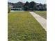 Lush green lawn with canal waterfront and dock at 4715 Jasper Dr # 208, New Port Richey, FL 34652