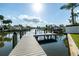 Waterfront home featuring a private boat dock offering easy access to canals and nearby waterways at 4908 Stolls Ave, Tampa, FL 33615