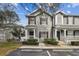 Charming two-story townhome featuring a well-maintained facade, inviting entrance, and manicured landscaping at 4927 Elizabeth Anne Cir, Tampa, FL 33616