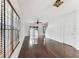 Bright living room with hardwood floors, a ceiling fan, and sliding doors to the backyard at 4927 Elizabeth Anne Cir, Tampa, FL 33616