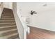 Carpeted staircase leads to the second floor adjacent to a spacious living area at 4927 Elizabeth Anne Cir, Tampa, FL 33616