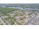 Aerial view of the community featuring beautiful lakefront property and mature tree coverage at 4965 Puritan Cir # 401, Tampa, FL 33617