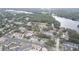 Aerial view of the community featuring beautiful lakefront property and mature tree coverage at 4965 Puritan Cir # 401, Tampa, FL 33617