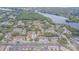 Aerial view of the community featuring beautiful lakefront property and mature tree coverage at 4965 Puritan Cir # 401, Tampa, FL 33617