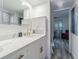 Bright bathroom with quartz countertop, modern gold faucet, and a stylish white vanity at 4965 Puritan Cir # 401, Tampa, FL 33617