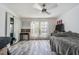 Bedroom with neutral tones, large window, and modern ceiling fan at 4965 Puritan Cir # 401, Tampa, FL 33617