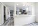 Kitchen overlooking the living room featuring a breakfast bar and modern lighting at 4965 Puritan Cir # 401, Tampa, FL 33617