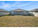 Backyard view featuring new construction, patio area and privacy fence at 5446 Blue Azure Dr, Wimauma, FL 33598