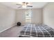 Neutral bedroom featuring a ceiling fan, window with blinds, and carpet flooring at 5446 Blue Azure Dr, Wimauma, FL 33598