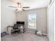 Bedroom featuring neutral walls, carpet flooring, a ceiling fan, and a window with blinds at 5446 Blue Azure Dr, Wimauma, FL 33598