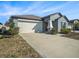 Lovely single-story home with attached two-car garage and well manicured front yard at 5446 Blue Azure Dr, Wimauma, FL 33598