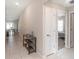 Hallway featuring neutral walls and tile flooring at 5446 Blue Azure Dr, Wimauma, FL 33598