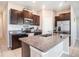 Modern kitchen featuring stainless steel appliances and a center island with a granite countertop at 5446 Blue Azure Dr, Wimauma, FL 33598