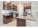 Kitchen with stainless steel appliances and granite countertops at 5446 Blue Azure Dr, Wimauma, FL 33598