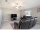 Living room featuring a fan and natural lighting at 5446 Blue Azure Dr, Wimauma, FL 33598