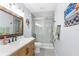 Modern bathroom featuring a sleek vanity and a frameless glass shower at 6029 Bayway Ct, New Port Richey, FL 34652