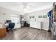 Bedroom space with laminate flooring, large windows, and room for an office at 6029 Bayway Ct, New Port Richey, FL 34652