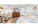 Bedroom with a wooden dresser, white walls, and wood-look flooring at 6029 Bayway Ct, New Port Richey, FL 34652