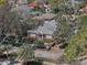 An aerial view showcases this well-kept home in a mature neighborhood with mature trees and landscaping at 635 13Th Ne Ave, St Petersburg, FL 33701