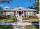 Charming brick home with a manicured front yard, walkway, and beautiful landscaping at 635 13Th Ne Ave, St Petersburg, FL 33701