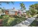 Charming home featuring manicured lawn, walkway, and classic architectural details at 635 13Th Ne Ave, St Petersburg, FL 33701