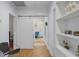 Hallway with sliding barn door and built-in shelves at 635 13Th Ne Ave, St Petersburg, FL 33701