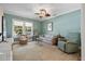 Cozy living room featuring a ceiling fan, neutral paint, and abundant natural light at 635 13Th Ne Ave, St Petersburg, FL 33701