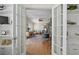 Living room with hardwood floors through french doors leading to office at 635 13Th Ne Ave, St Petersburg, FL 33701