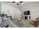 Inviting living room with fireplace, ceiling fan, and lots of natural light at 635 13Th Ne Ave, St Petersburg, FL 33701