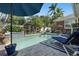 Inviting pool area features lush tropical landscaping, water feature, and lounge chairs for relaxation at 635 13Th Ne Ave, St Petersburg, FL 33701