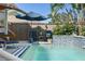 Refreshing pool featuring a water feature and comfortable poolside seating at 635 13Th Ne Ave, St Petersburg, FL 33701