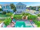 Aerial view of a home with a private pool, lush landscaping, and a fenced backyard at 6571 Simone Shores Cir, Apollo Beach, FL 33572