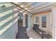 Relax on this cozy outdoor balcony with two lounge chairs and a sunshade cover at 6571 Simone Shores Cir, Apollo Beach, FL 33572