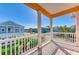 Enjoy views from this spacious outdoor balcony with shade cover and decorative pillars at 6571 Simone Shores Cir, Apollo Beach, FL 33572