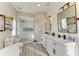 Bathroom featuring a glass shower with detailed tiles and a double vanity at 6571 Simone Shores Cir, Apollo Beach, FL 33572