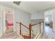 Hallway featuring wood flooring and a staircase leading to the upper level at 6571 Simone Shores Cir, Apollo Beach, FL 33572