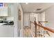 Hallway featuring a laundry area, hardwood floors and stairs at 6571 Simone Shores Cir, Apollo Beach, FL 33572