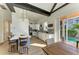 Well-lit kitchen featuring modern appliances, breakfast bar, and access to pool area at 6571 Simone Shores Cir, Apollo Beach, FL 33572