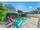 The backyard has a pristine pool with plenty of patio seating at 6571 Simone Shores Cir, Apollo Beach, FL 33572