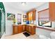 Bathroom with wood cabinets, granite counters, and a tiled shower at 719 21St N Ave, St Petersburg, FL 33704