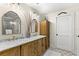 Bright bathroom featuring a double vanity with a marble countertop and patterned tile floor at 719 21St N Ave, St Petersburg, FL 33704