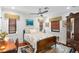 Bedroom featuring a bed with patterned covers, wood floors, blinds, and a ceiling fan at 719 21St N Ave, St Petersburg, FL 33704