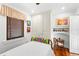 Bedroom featuring hardwood floors, a bed with patterned covers, and ample storage in the built in wardrobe at 719 21St N Ave, St Petersburg, FL 33704