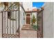 Inviting entrance with a decorative gate, stone steps, and a solid wood front door at 719 21St N Ave, St Petersburg, FL 33704