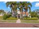 Inviting home featuring a classic design, lush landscaping, and a charming brick walkway at 719 21St N Ave, St Petersburg, FL 33704