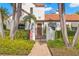 Stunning entryway with a detailed doorway, lush greenery, and unique architectural details at 719 21St N Ave, St Petersburg, FL 33704